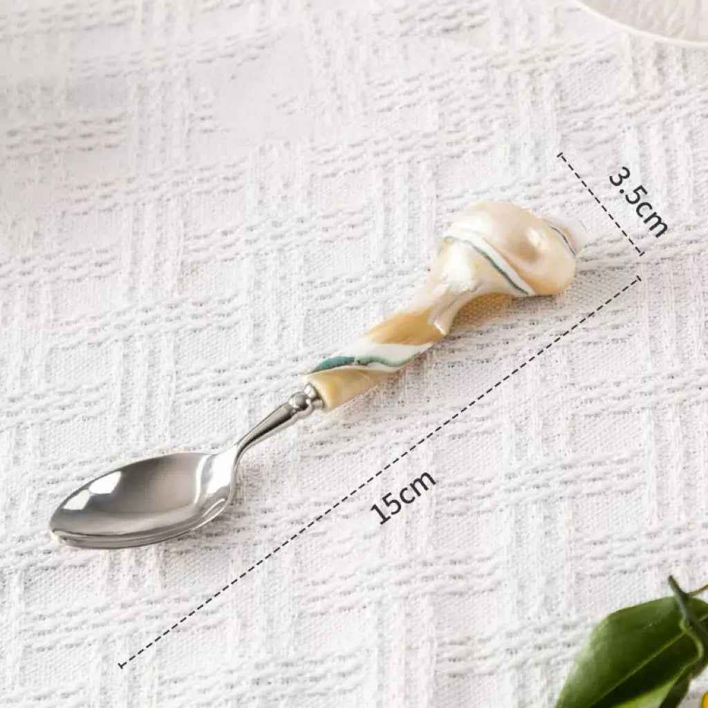Shell-handled spoon and fork with a 15 cm size reference