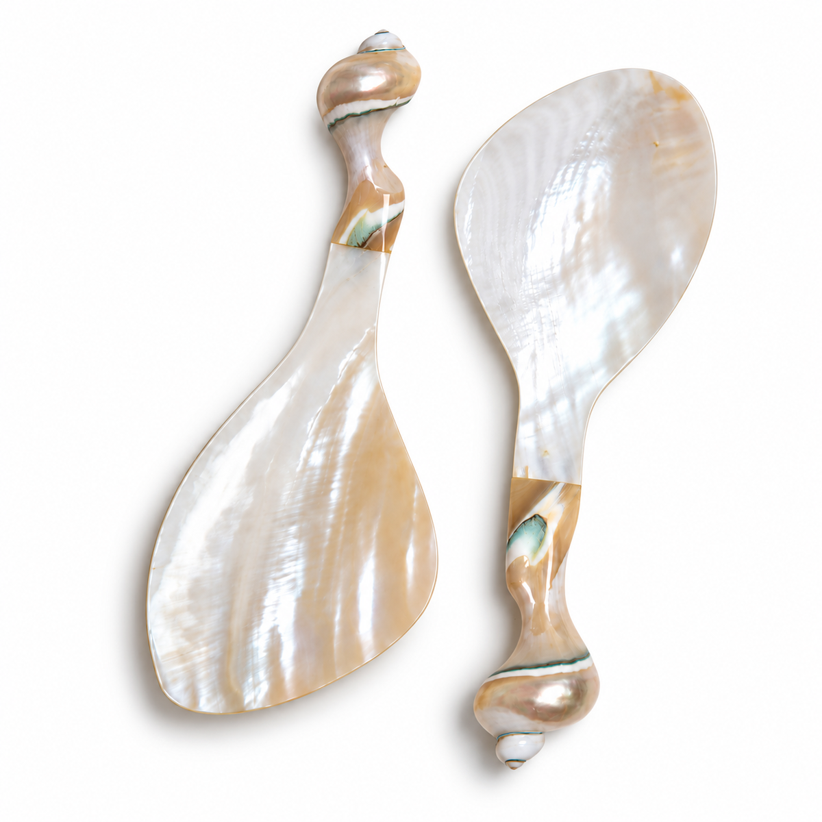 Natural pearl white shell rice paddle showcasing glossy mother of pearl finish and sculptural handle