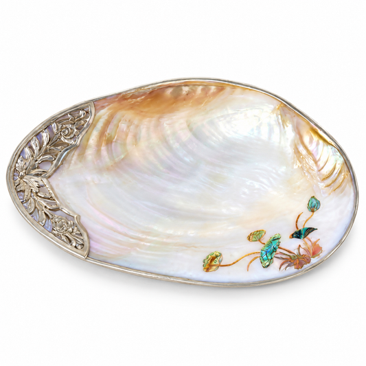 Large natural mother-of-pearl shell tray with silver-tone floral edge and lotus inlay on white background